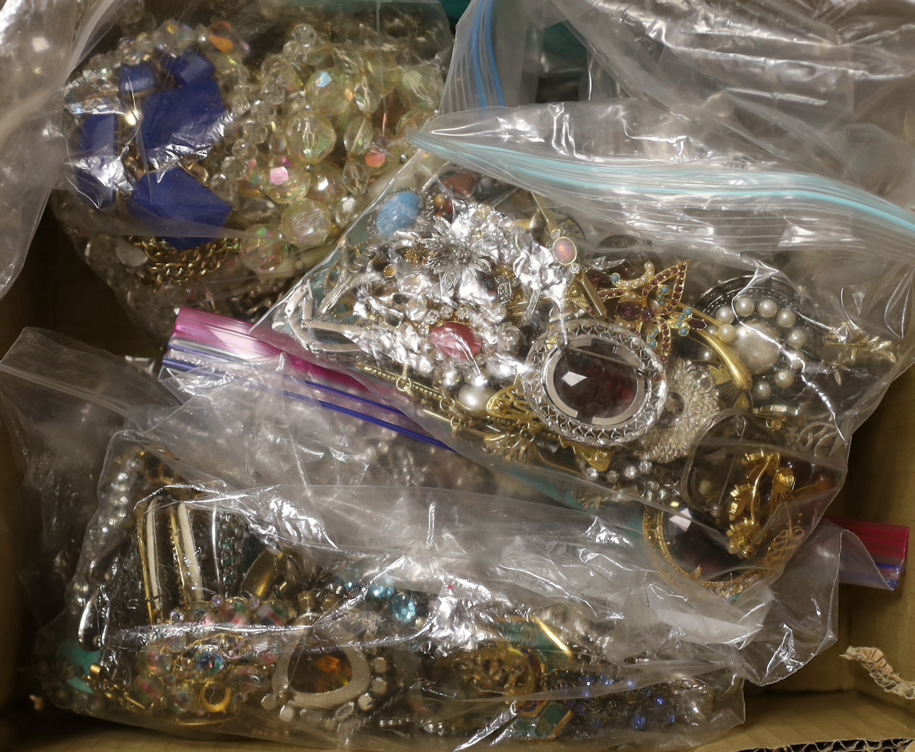 Ten bags of assorted costume jewellery, including necklaces, bracelets, brooches, etc.